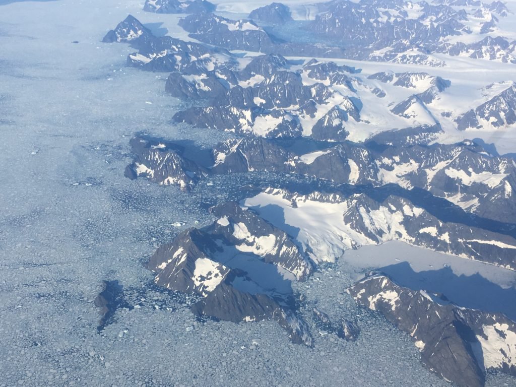 Flying over the dramatic Eastern shore of Greenland