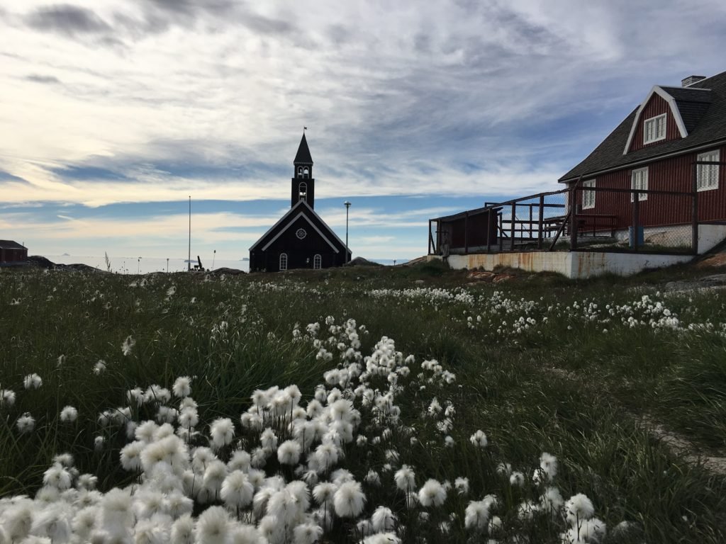 Black wooden Zion church in Ilulissat during summertime