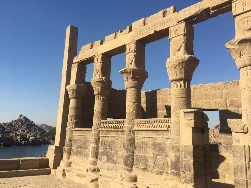 Carved faces of goddess Isis watch over the Nile