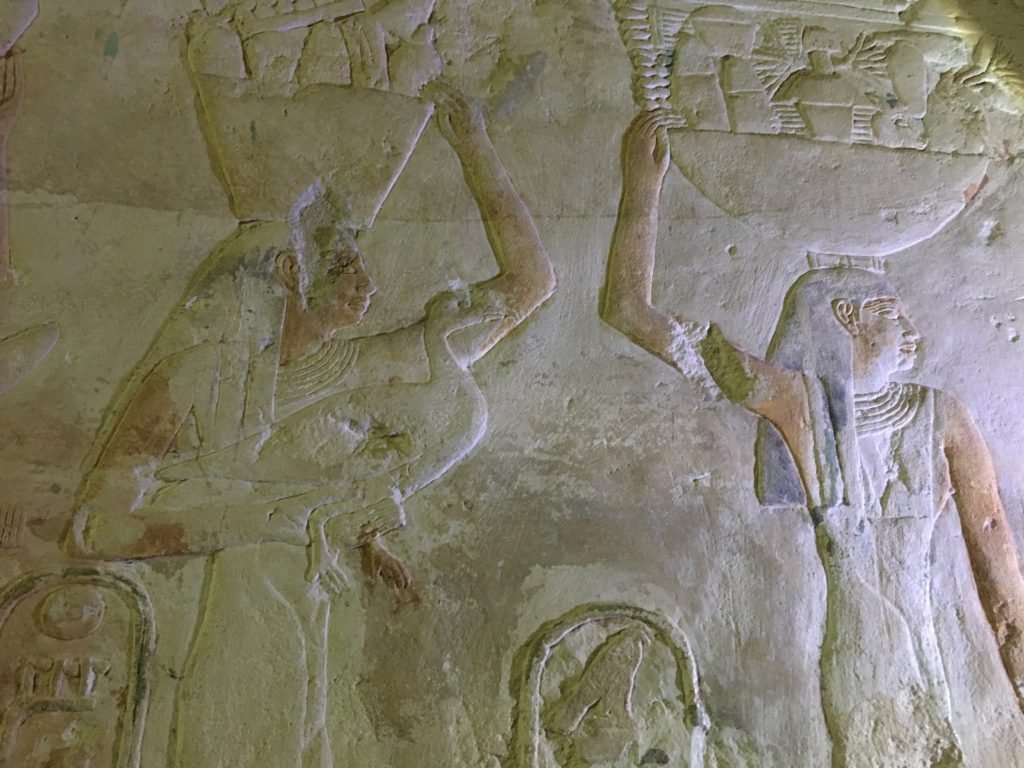 Paintings on the wall of Ptahhotep's mastaba, women carrying baskets of fruits